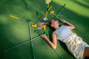 Laying Down on Gum Green and Yellow Putters
